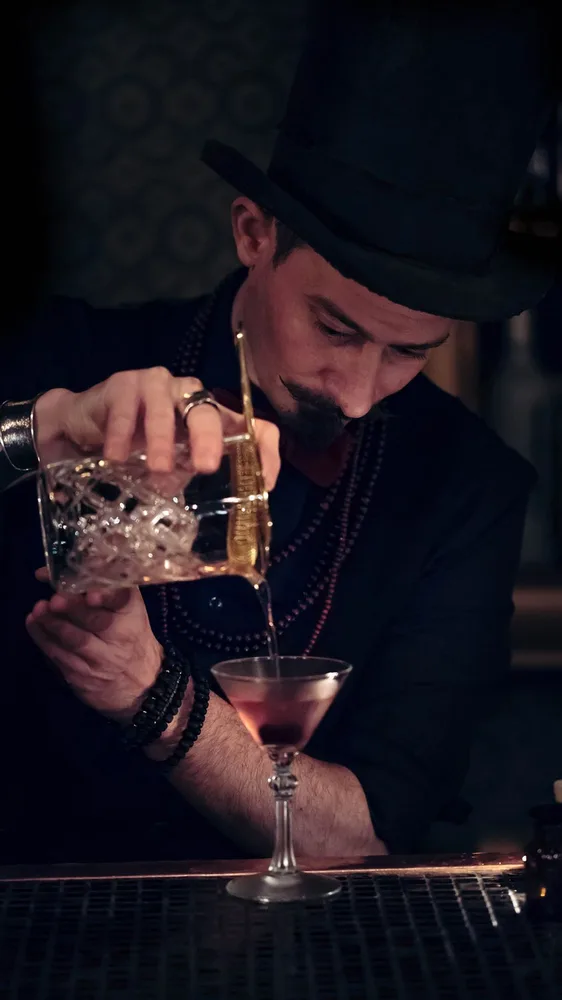Mixologist Pouring Cocktail Mixologist Pouring Cocktail